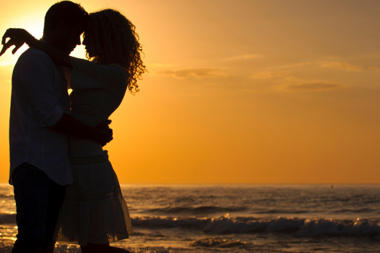 couple on the beach at sunset
