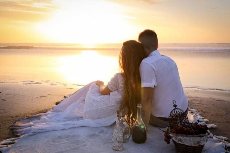 couple sitting on the beach