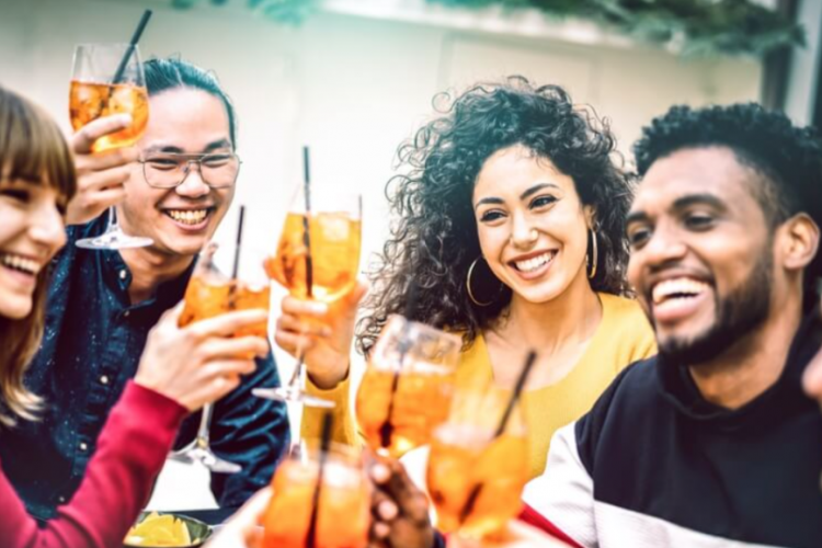 friends toasting to one another