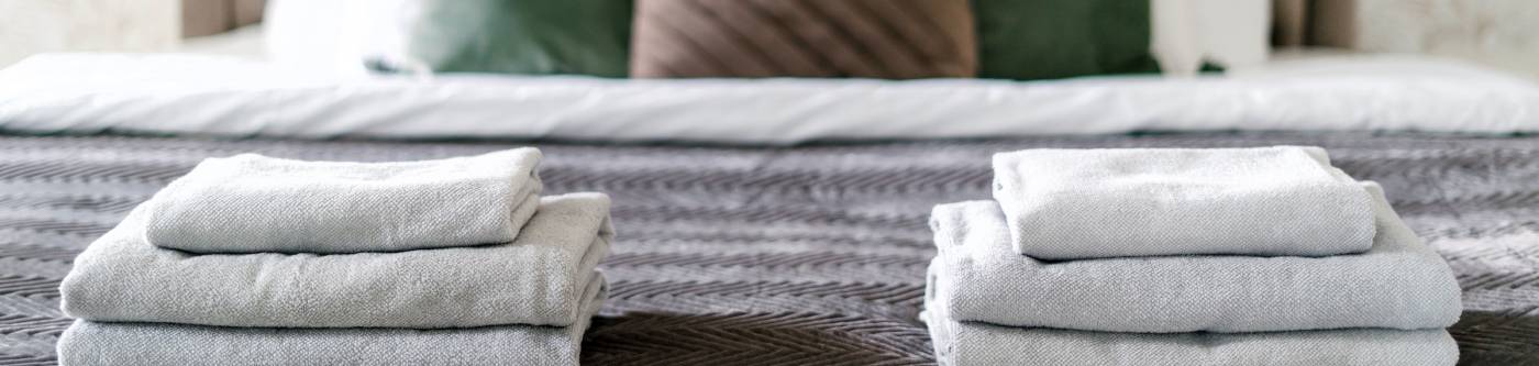 folded linens on a bed